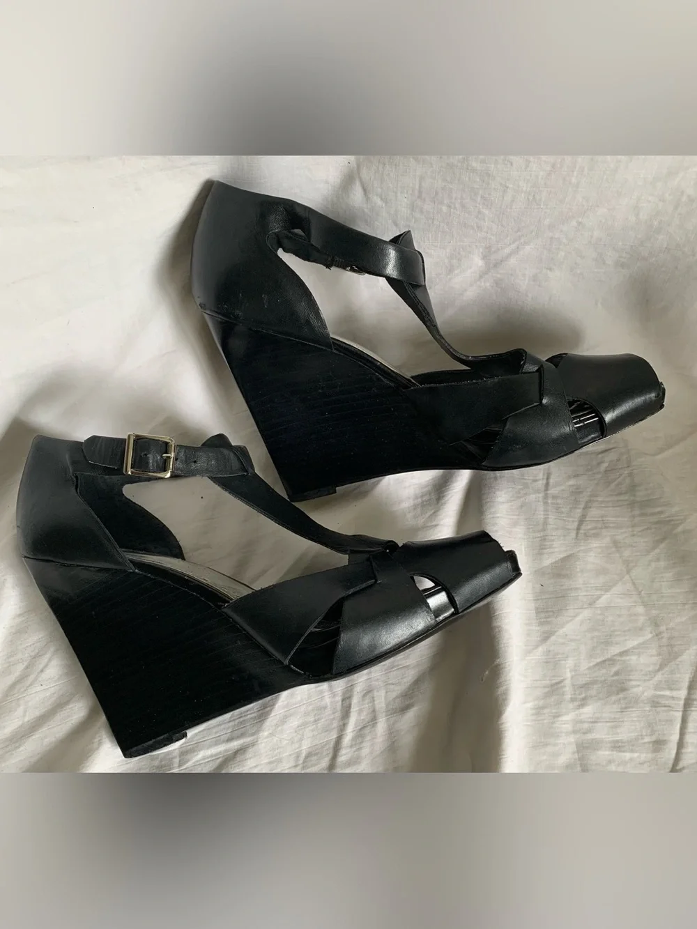 BCBGirls Black Leather Peep-Toe T-Strap Wedge Sandals with Buckle